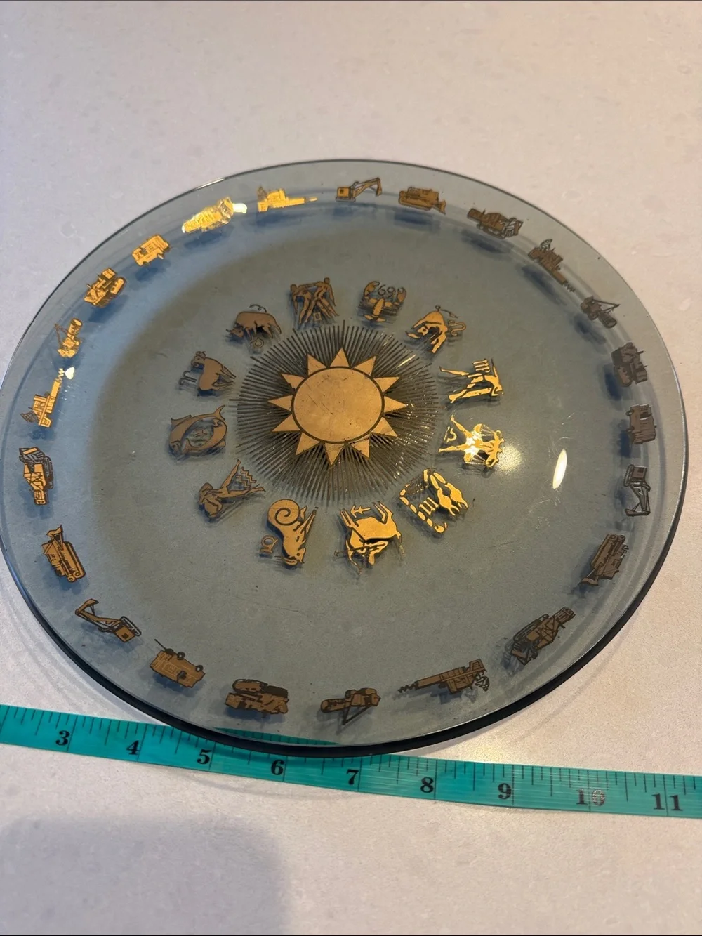 Glass Decorative Plate with Gold Zodiac Accents and heavy equipment